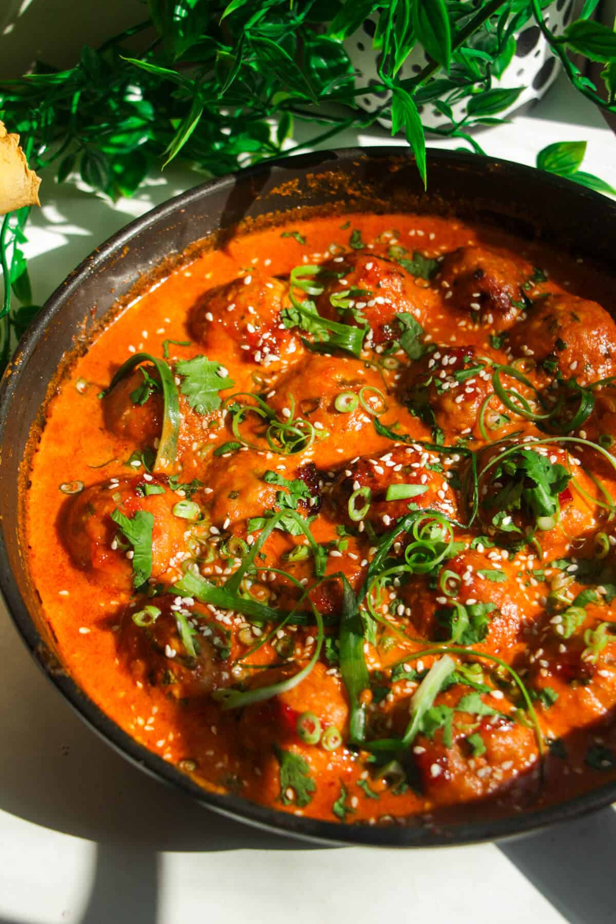 Gochujang chicken meatballs in a pan.