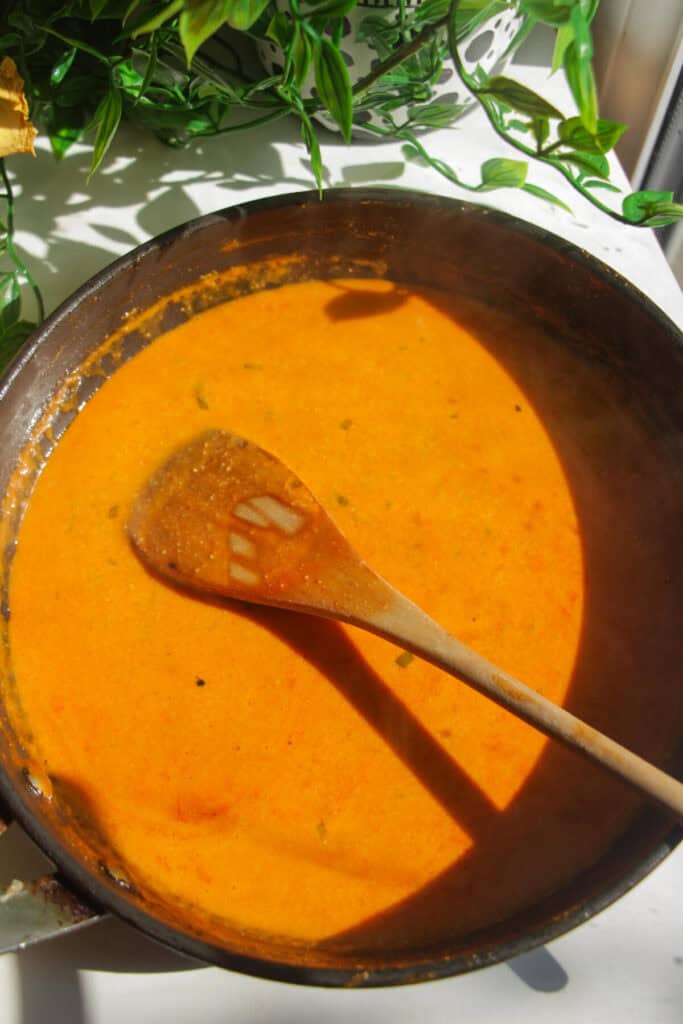 Coconut milk gochujang sauce mixed in a pan.