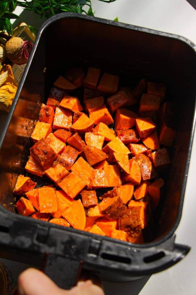 Cubed sweet potatoes tossed with miso and olive oil.