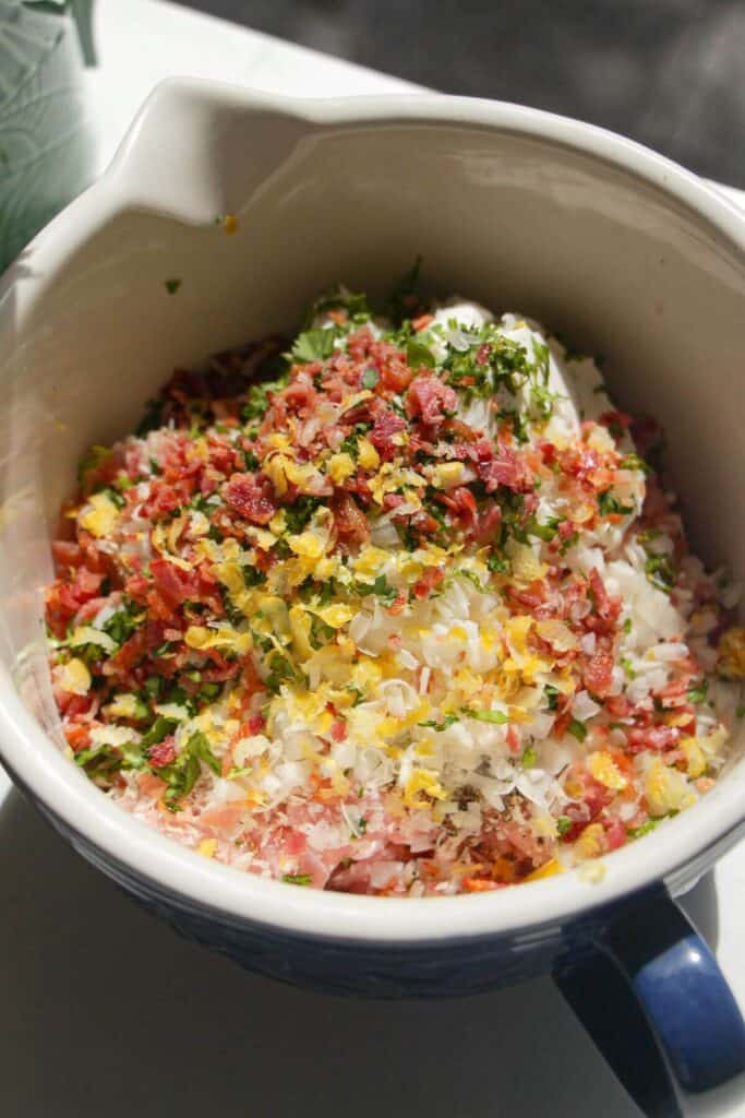 Chicken Caesar meatballs ingredients in bowl.