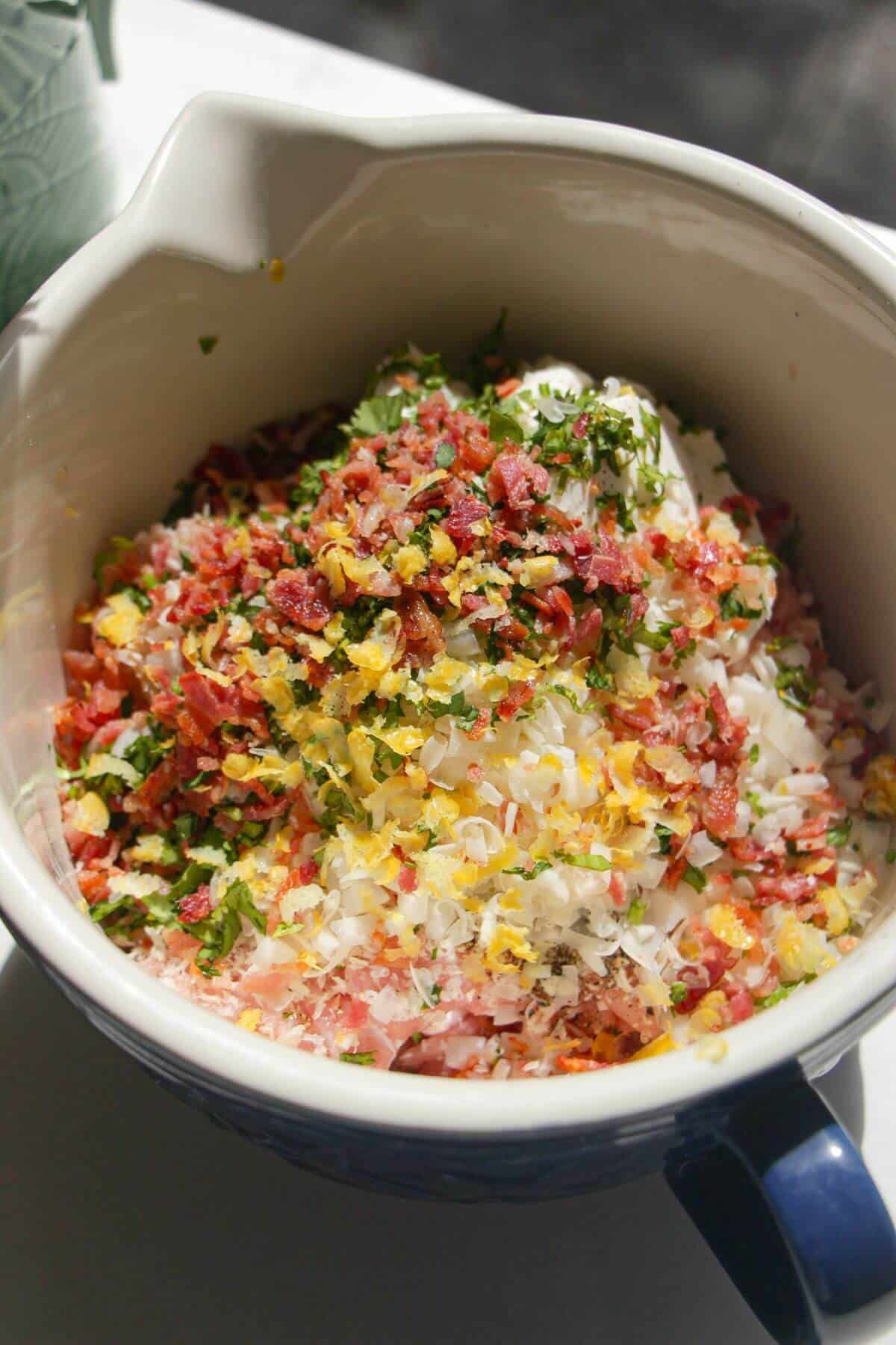 Chicken Caesar meatballs ingredients in bowl.