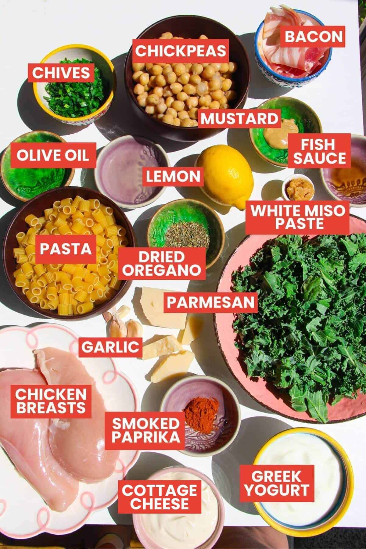 Ingredients for Caesar pasta salad laid out and labelled.