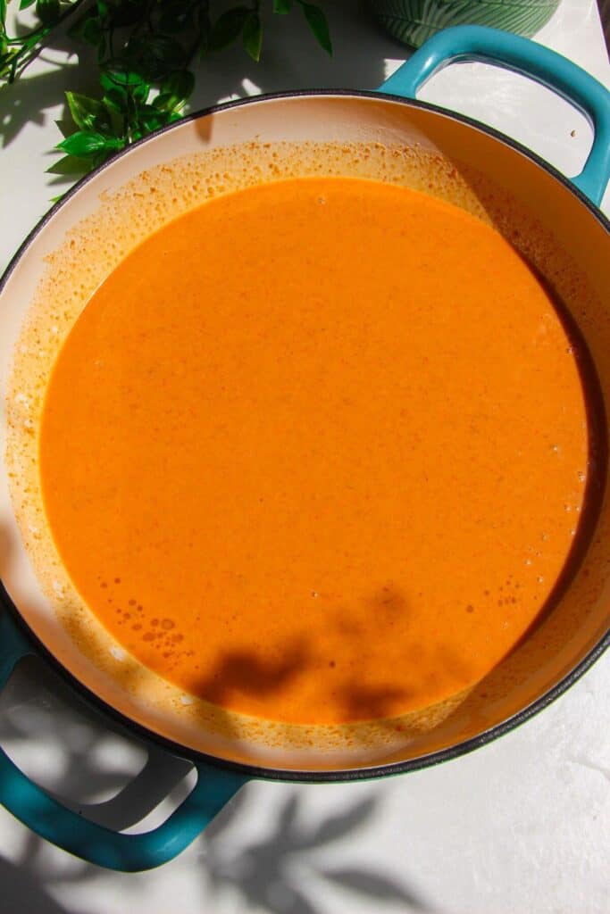 Coconut satay sauce mixed in a skillet.