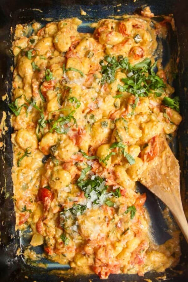 Baked cheesy tomatoey Boursin gnocchi in an oven tray.