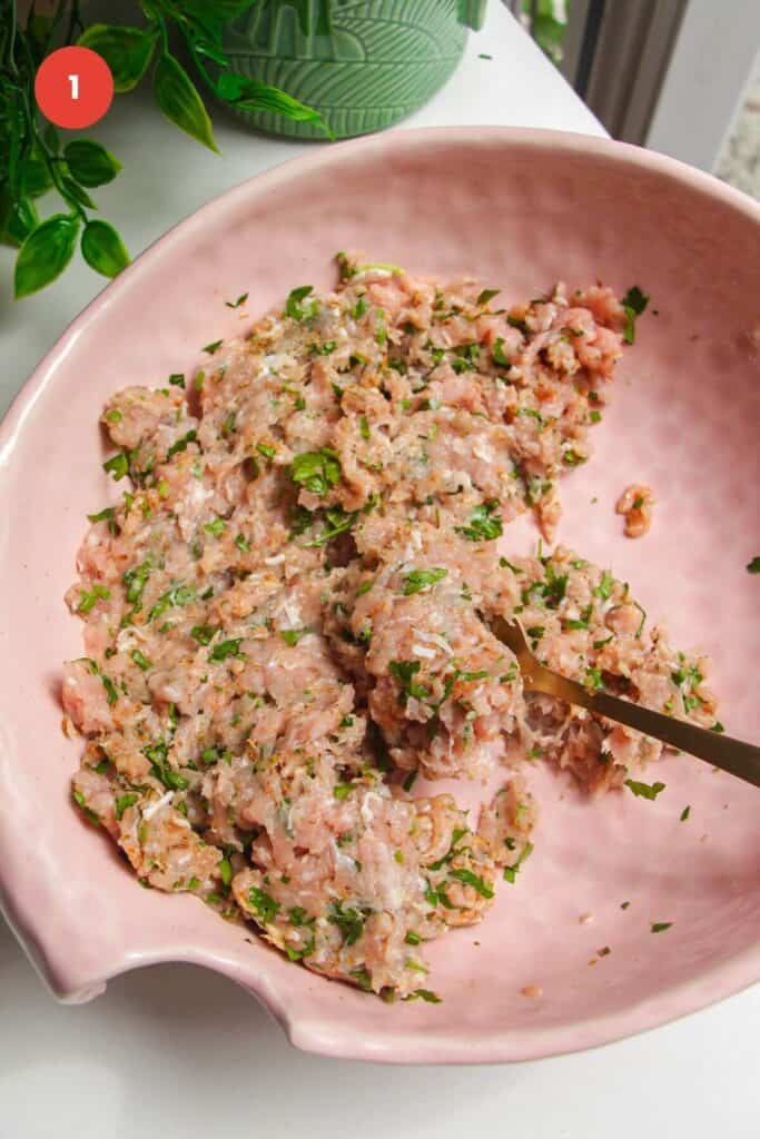 Ground chicken gyros taco topping mixed in large bowl.