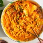 Butternut noodles in a bowl, with chopsticks.