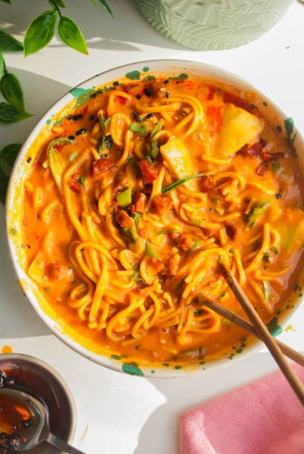 Butternut noodles in a bowl, with chopsticks.