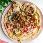 Chicken doner with salad, flatbreads and hummus.