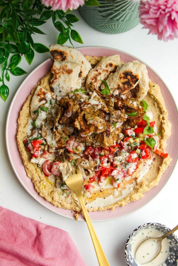 Chicken doner with salad, flatbreads and hummus.