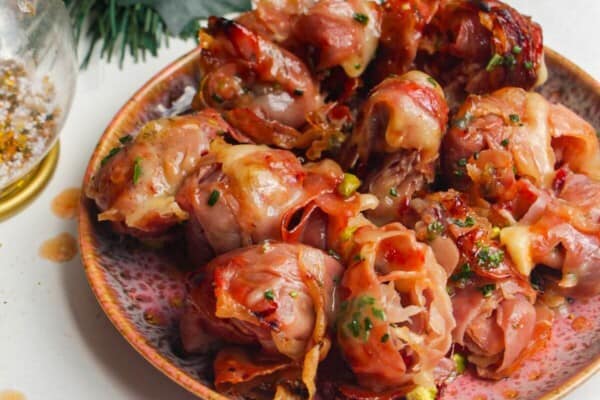 Plate of brie, prosciutto bombs.