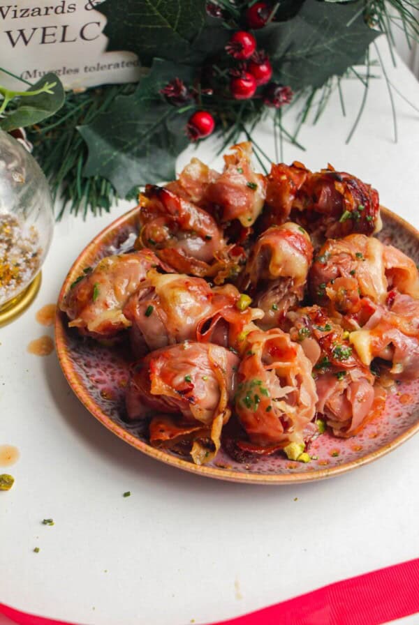 Plate of brie, prosciutto bombs.