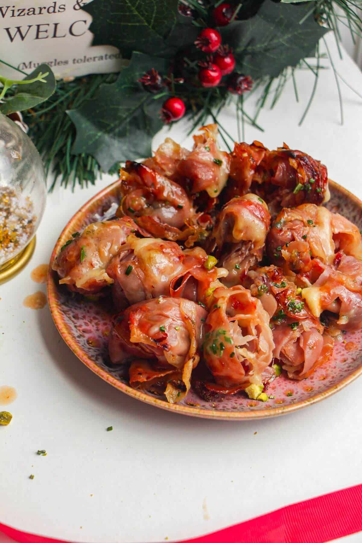 Plate of brie, prosciutto bombs.