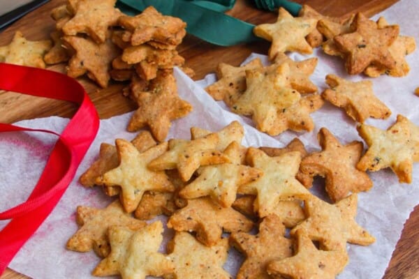 Chili cheese shortbread stars on a serving board.