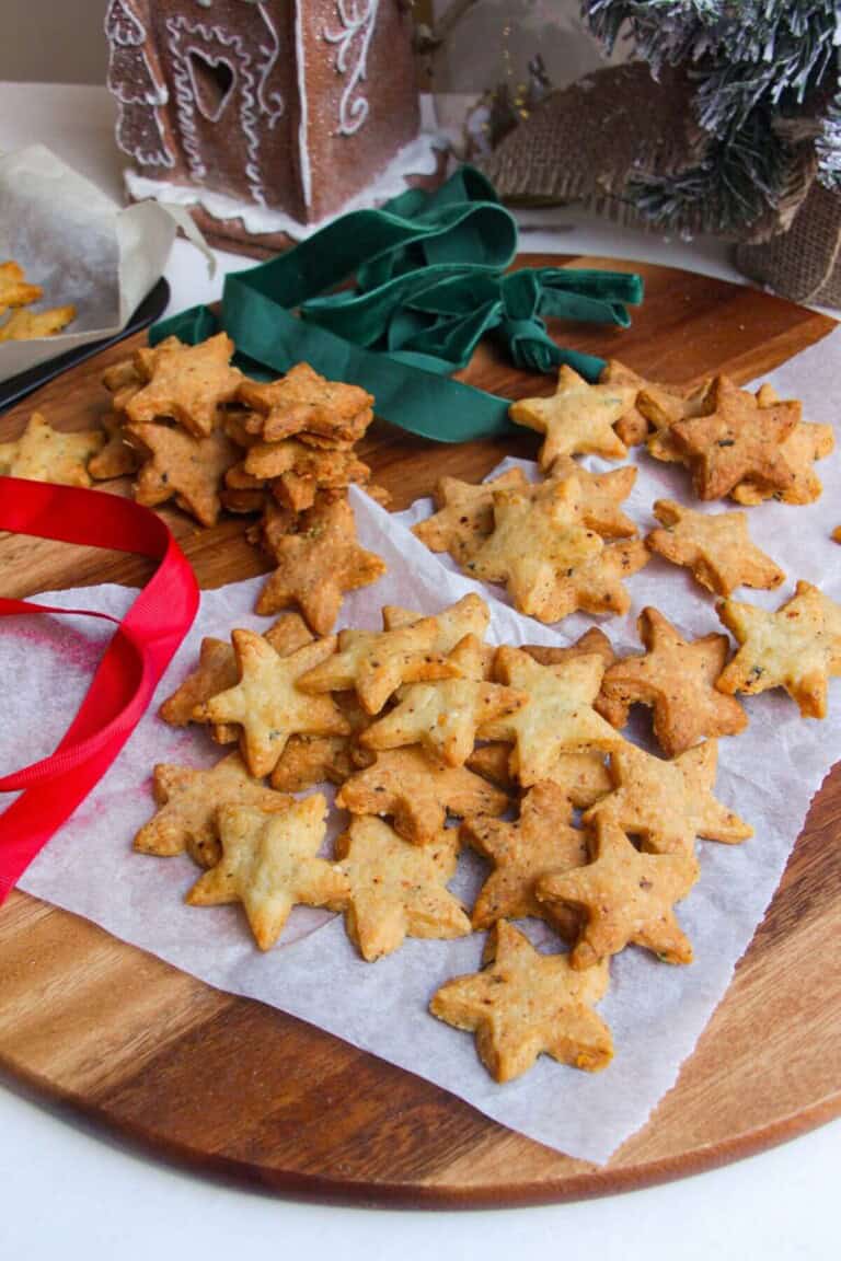 Chili cheese shortbread stars on a serving board.