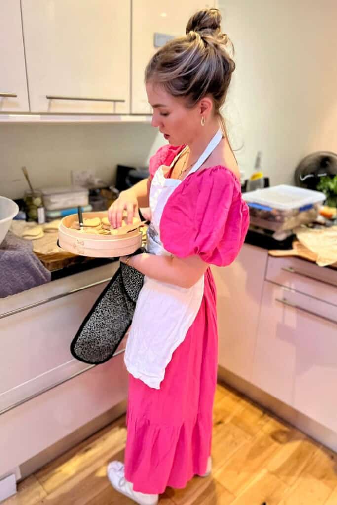 Kate cooking in kitchen.