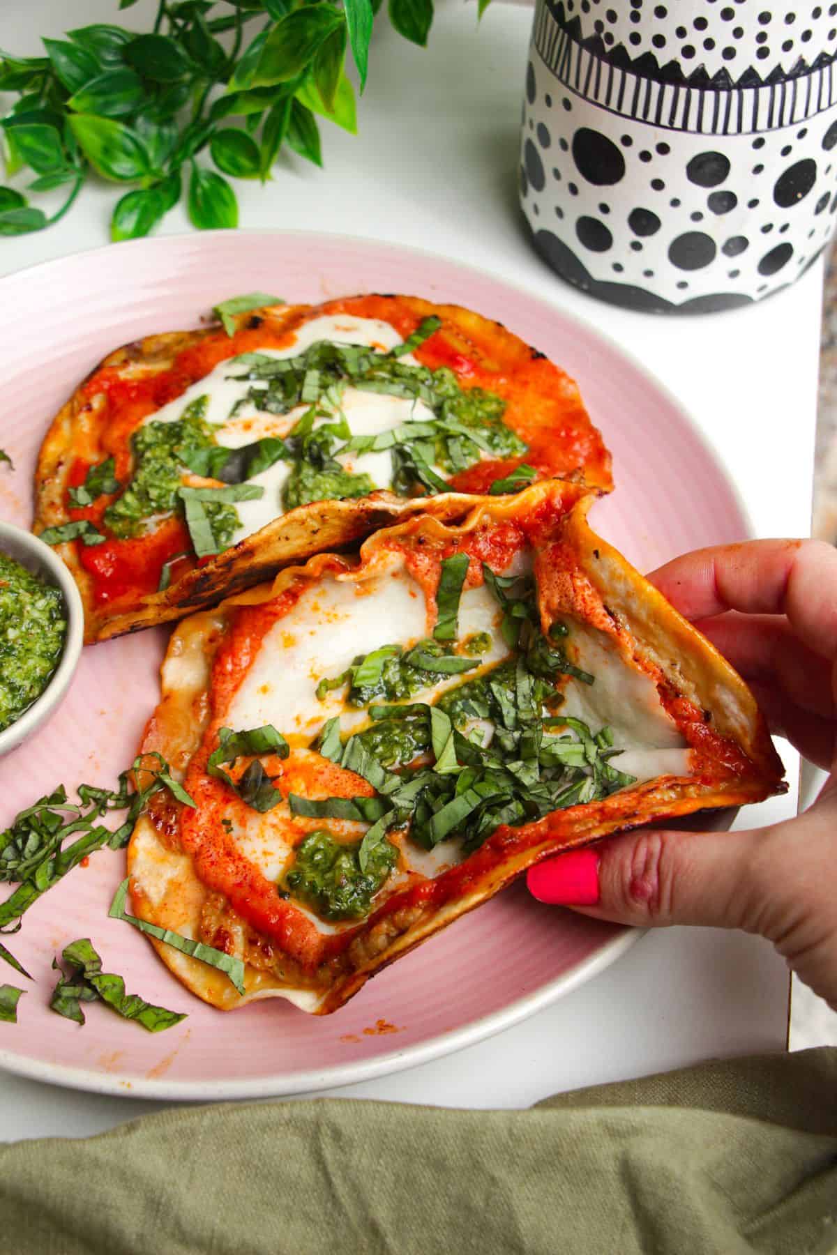 Picking up a chicken parmigiana taco.