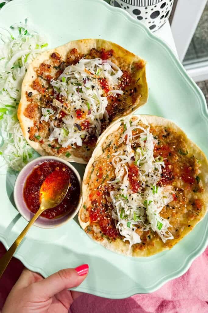 Sweet chili chicken tacos on platter.