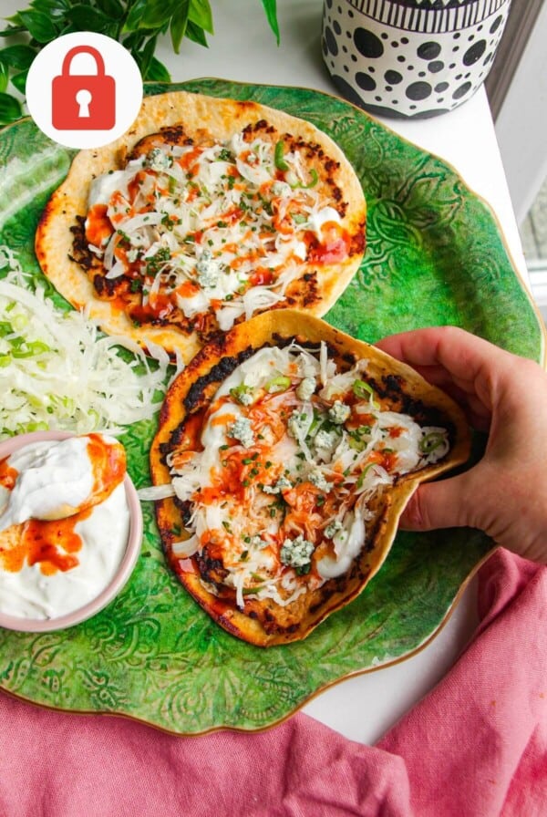 Buffalo chicken tacos on a platter.
