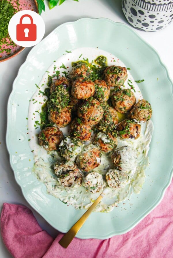 Lemon chicken meatballs on whipped feta with pesto.