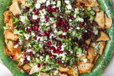 Middle Eastern nachos on pita chips.