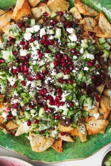 Middle Eastern nachos on pita chips.