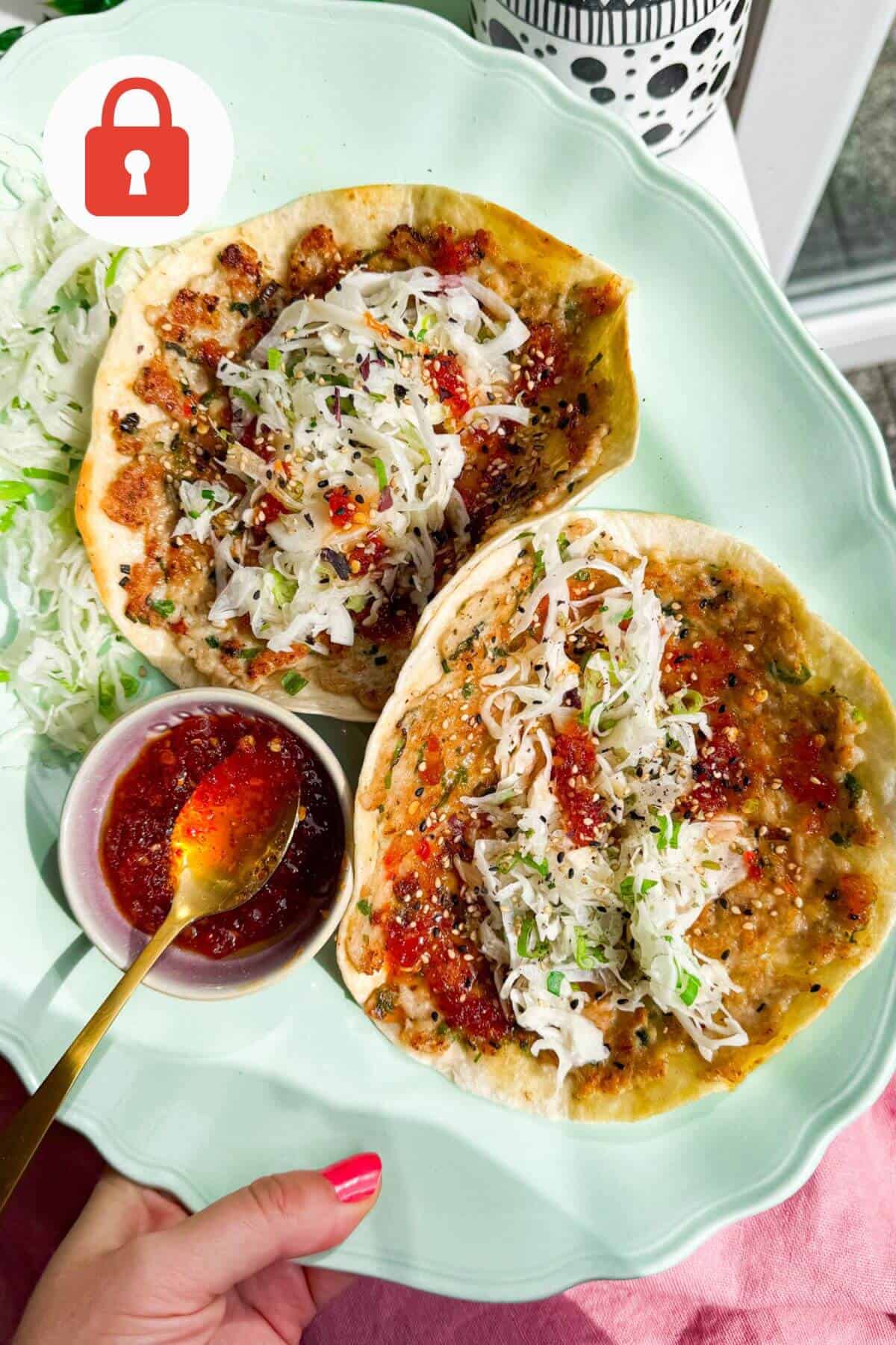 Sweet chili chicken tacos on a platter.