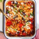 Harissa chicken baked with tomatoes, feta and chickpeas.