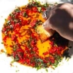 Pizza dipping oil on a serving plate.