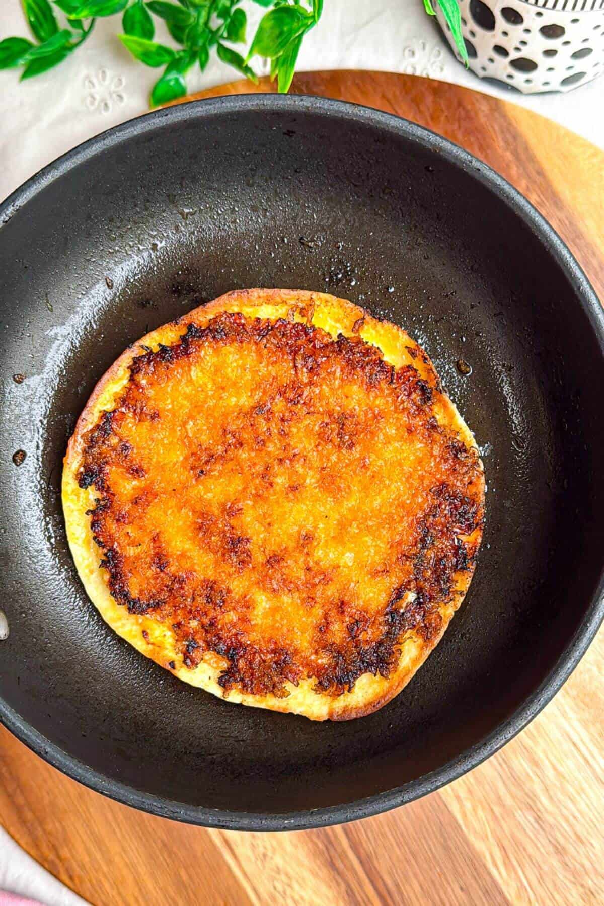 Crispy panko topped smash taco in pan.